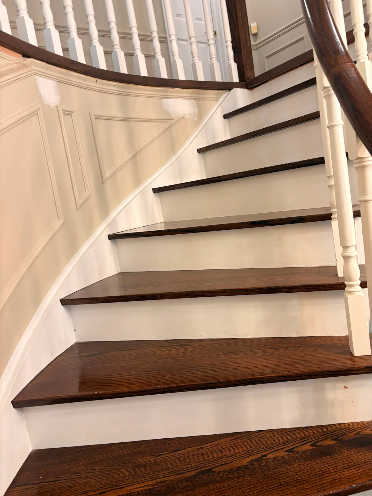 Before — Curved staircase after detailed construction cleanup.