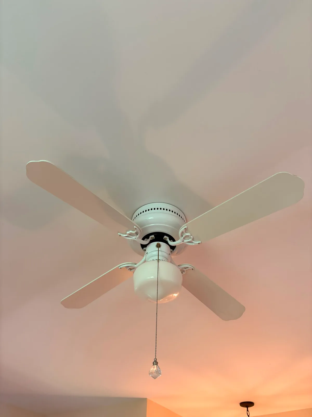 After — Ceiling fan detail before and after post-construction cleaning.