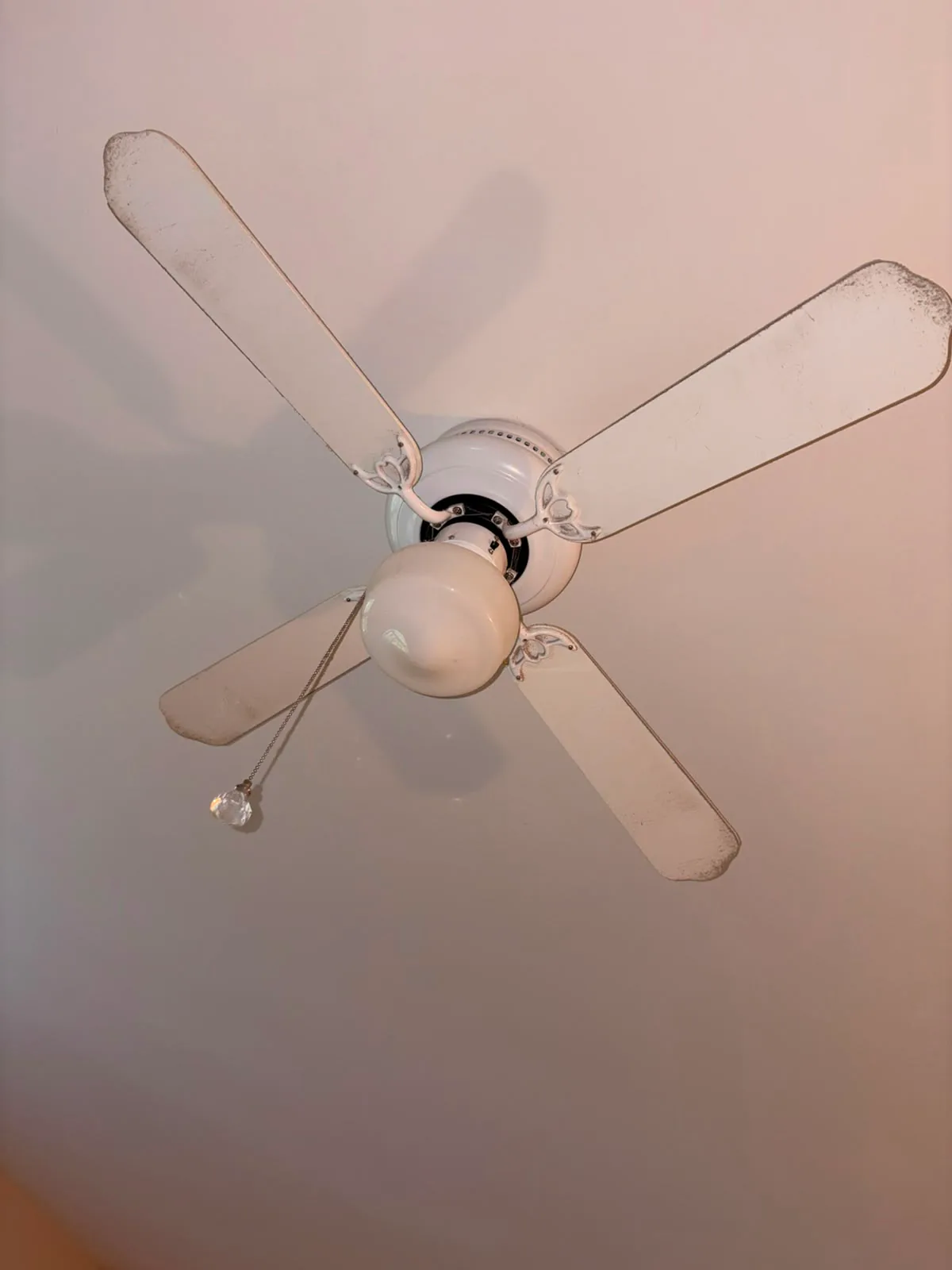 Before — Ceiling fan detail before and after post-construction cleaning.